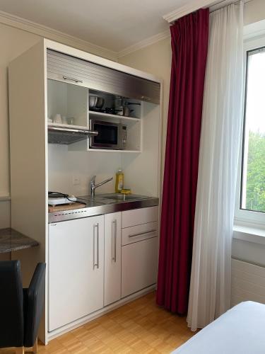 Kitchen, Swiss Star Irchel - Self Check-In in Zürich