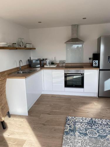 Studio Cabin Retreat with Hot Tub Sea and Downs views in Seaford with own garden in Seaforde
