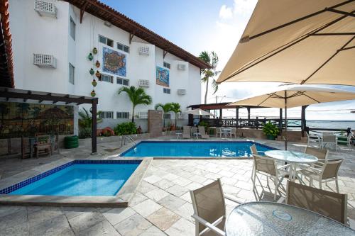 สระว่ายน้ำ, Hotel Costeiro in โอลินด้า