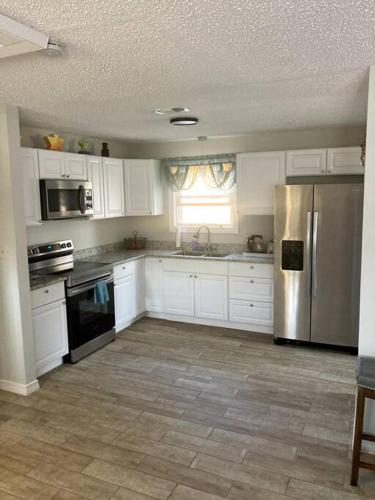 Very Private 3 Bed Home with HEATED Pool Palms and Big Fenced Yard in Myrtle Grove