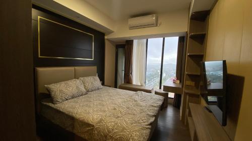 B&B Batam Centre - Meisterstadt Pollux Habibie Apartment by uhomeid - Bed and Breakfast Batam Centre