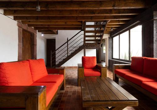 ห้องส่วนกลางสำหรับนั่งเล่น/ดูทีวี, Hotel & Temazcal Hacienda Maxtha in ซาน ฮวน เดล ริโอ