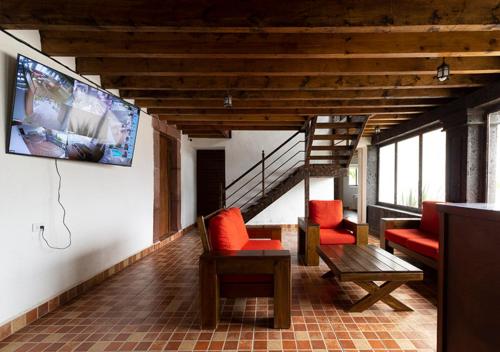 公共休息室/电视室, Hotel & Temazcal Hacienda Maxtha in 圣胡安德尔里奥