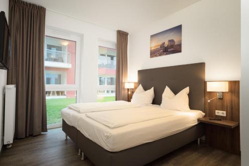 Ferienwohnung direkt am Meer mit Pool und Sauna, Strand fußlaufig erreichbar, barrierefrei in Olpenitz