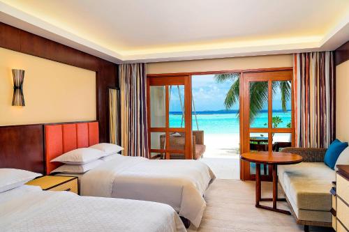 Deluxe Double Room with Two Double Beds and Beach View room in Sheraton Maldives Full Moon Resort & Spa