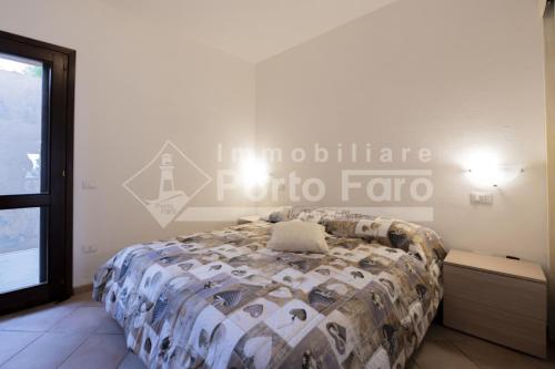 L325 - Bilocale con giardino e vista mare panoramica a Porto Mannu, Palau (foto 5)