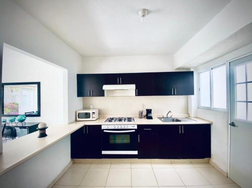 Kitchen, NUEVO EN BOOKING CASA TERRANIUM ACAPULCO DIAMANTE in La Poza