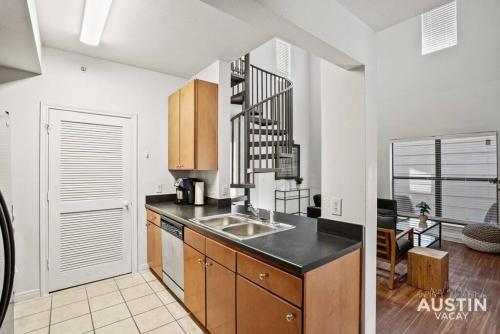 Spiral Stairs to Loft Bedroom Balcony with Shade in Austin, USA