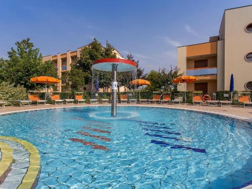 Swimming pool, Lovely apartment in Caorle with shared garden in Brian
