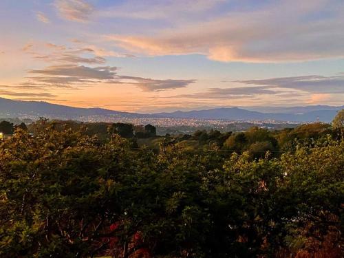 House with spectacular mountain and city views.