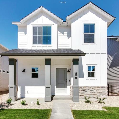 Hygee House Brand New Construction near Ford Idaho Center and I-84! Plush and lavish furniture, warm tones to off-set the new stainless appliances, play PingPong in the garage or basketball at the neighborhood park