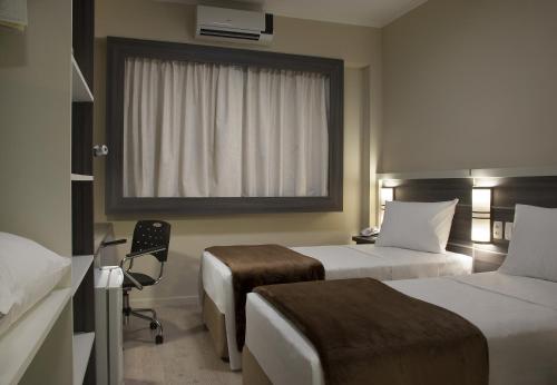 Master Express Dom Pedro II - Aeroporto Set in a prime location of Porto Alegre, Master Express Dom Pedro II puts everything the city has to offer just outside your doorstep. Offering a variety of facilities and services, the hotel provides