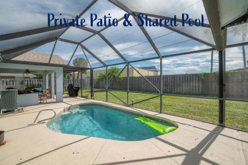 Serene Seaside Retreat - Dog friendly - 2BR Townhouse with Shared Heated Pool Steps to Paradise Beach!