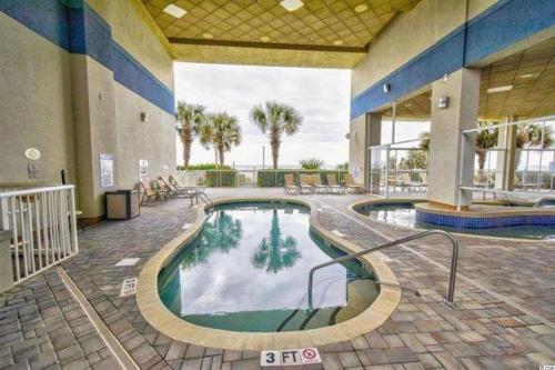 Breathtaking 2BR Condo w Floor-to-Ceiling Windows Overlooking Ocean - image 2