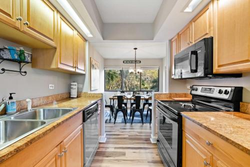 Coastal Oasis with Pool Access and Walk to Beach! - image 12