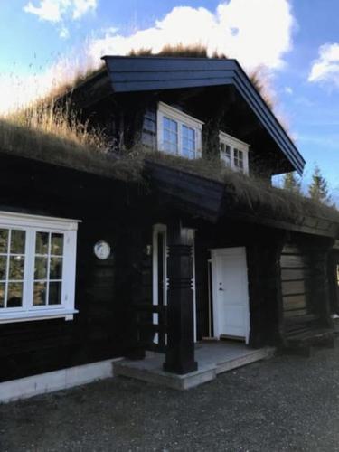 Log cabin on Natrudstilen Sjusjøentrail outside