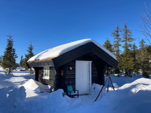 Log cabin on Natrudstilen Sjusjøentrail outside