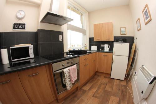 kök, Parterre Holiday Apartments in Södra Sandown