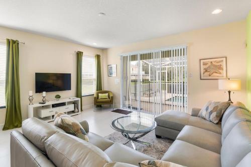 SERENITY 3 Bed 3 Bath Townhome with Pool, Private Balcony, Clubhouse, Communal Pool, Conservation View, Disney 15 mins by Orlando Holiday Rental Homes LLC 1507T in Orlando, USA