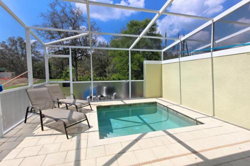 SERENITY 3 Bed 3 Bath Townhome with Pool, Private Balcony, Clubhouse, Communal Pool, Conservation View, Disney 15 mins by Orlando Holiday Rental Homes LLC 1507T in Orlando, USA