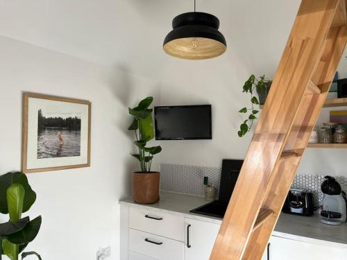 Tiny guesthouse with cozy mezzanine sleeping nook