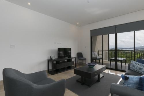 Shared lounge/TV area, Cozy 1BR Condo with Partial Ocean View - Roble Sabana - Reserva Conchall in Playa Conchal