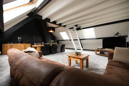 Shared lounge/TV area, 8 person apartment with heated swimmingpool Hoek van Winssen in Winssen