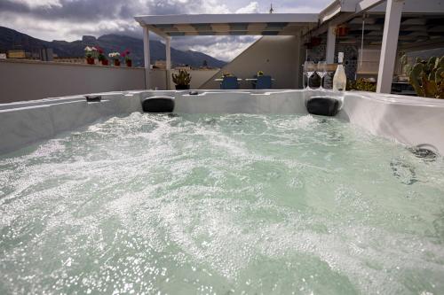 Acquarò Suite Jacuzzi - Tap to explore photos