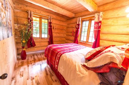 Chalet bois rond aux paysages uniques avec Spa !