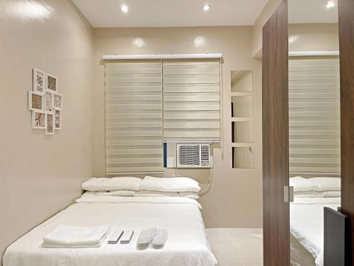 Condo along Tomas Morato w/ WiFi SmartTV & Karaoke, Bocaue