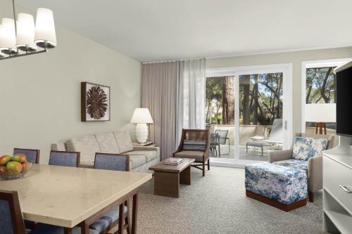 Two-Bedroom Villa with One King Bed, Two Twin Beds, Sofa Bed, Balcony and Garden View