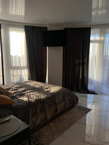 Designer apartment with a large panoramic terrace generator separate bedroom and a comfortable sofa bed.