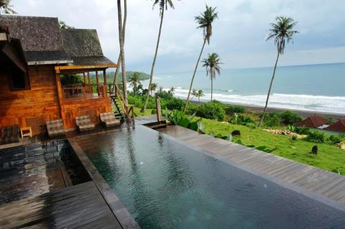 4 bedrooms villa with sea view private pool and furnished garden at Kabupaten de Tabanan