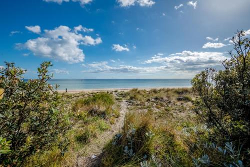 Beachfront-private beach access and 180 degree bay views!