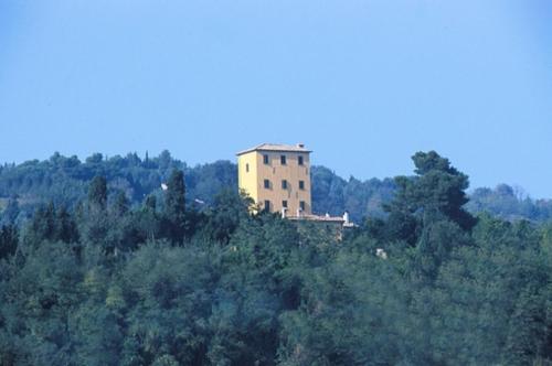 a large building with trees and a sky background, Locanda Di Villa Torraccia in Pesaro
