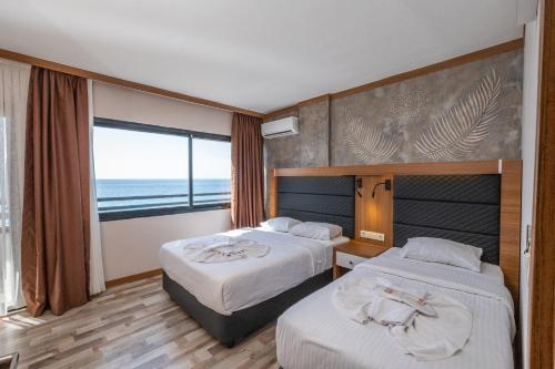 Zimmer mit 2 einzelbetten, meerblick, balkon