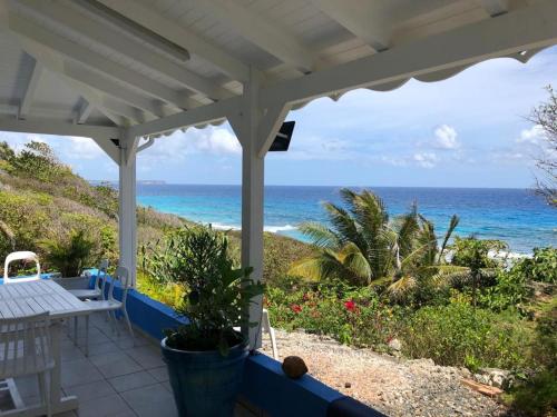 Bungalow vue mer avec accès direct littoral/mer. - Location saisonnière - Le Moule