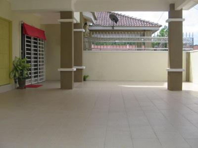 a room with a door open and a building behind it, Greenleaf Villa in Jerantut