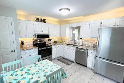 Three Bedrooms Two and half baths end unit few blocks from beach