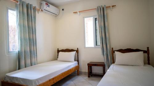 Tulia House - Hostel Room Type - Budget Twin Room