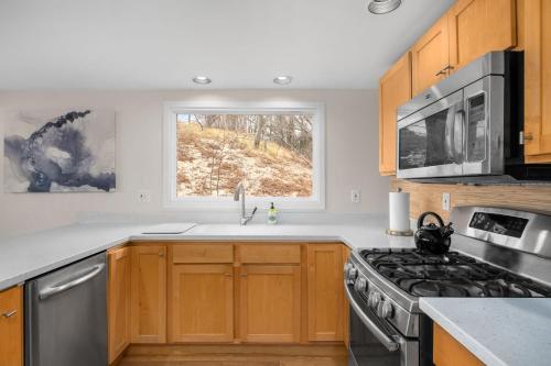 Lakefront House with Private Beach by Michigan Waterfront Luxury Properties in Norton Shores, USA