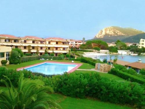 Cosy holiday home in Marinella with shared pool