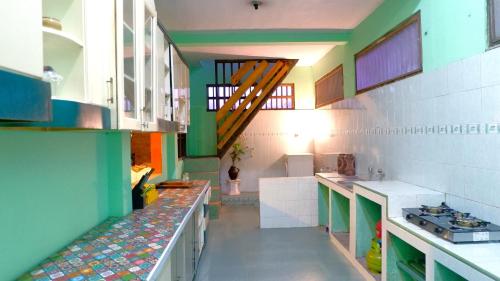 Kitchen, Sleepy Raccoon Hostel near Rumah Sakit Khusus Bedah Rskb Ring Road Selatan
