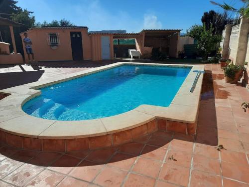 Private villa with heated pool close to the beach.