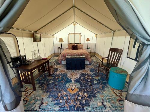 Bed, Zinnia Glamping Tent at Zenzen Gardens in Paonia (CO)