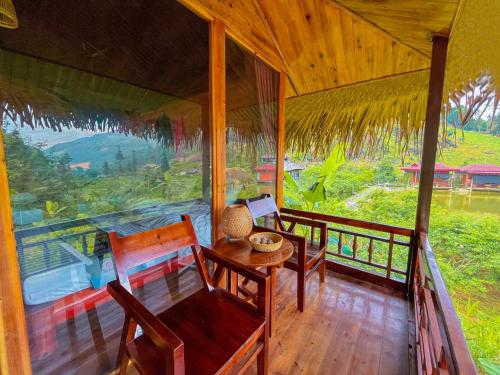 balkon/terasa, Dům (27 m²), pokoje: 1, vlastní koupelny: 1, destinace: Bac ha (Bac Ha Lodge Retreat) in Bac Ha (Lao Cai)