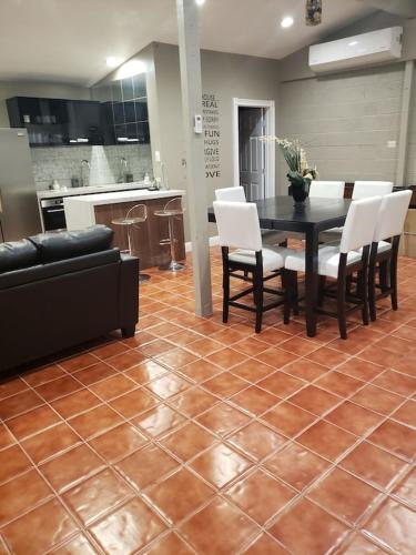 Luxury Villa, with bonus pool house, Private Pool, Hot tub, rock water fall and slide, putting green, basketball, shuffle board, play gym, privately gated on circular driveway.