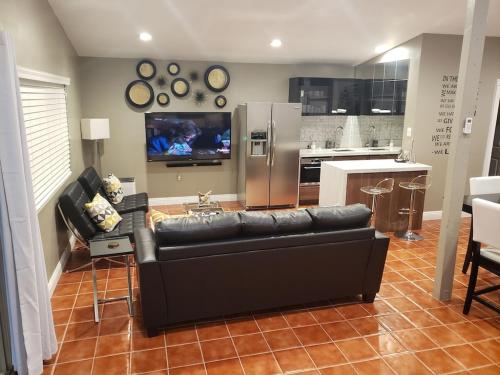 Luxury Villa, with bonus pool house, Private Pool, Hot tub, rock water fall and slide, putting green, basketball, shuffle board, play gym, privately gated on circular driveway.