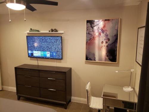 Luxury Villa, with bonus pool house, Private Pool, Hot tub, rock water fall and slide, putting green, basketball, shuffle board, play gym, privately gated on circular driveway.