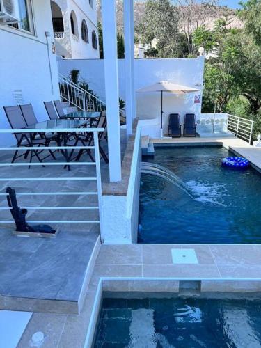 Magnifique logement A avec vue sur mer et piscine, jacuzzi, chauffés, chauffe payant (Magnifique logement A avec vue sur mer et piscine, jacuzzi, chauffes, chauffe payant) in Rancho Domingo